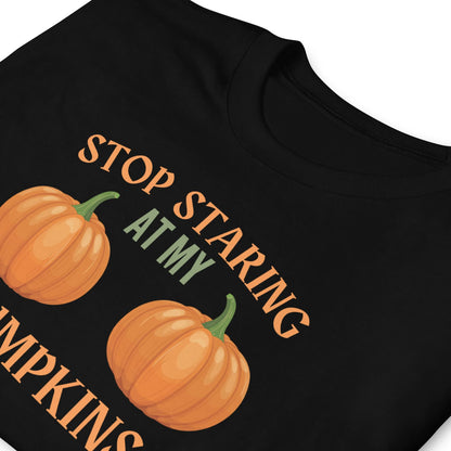 Black halloween t-shirt with pumpkins and adult humor text 'Stop Staring At My Pumpkins' on a white background