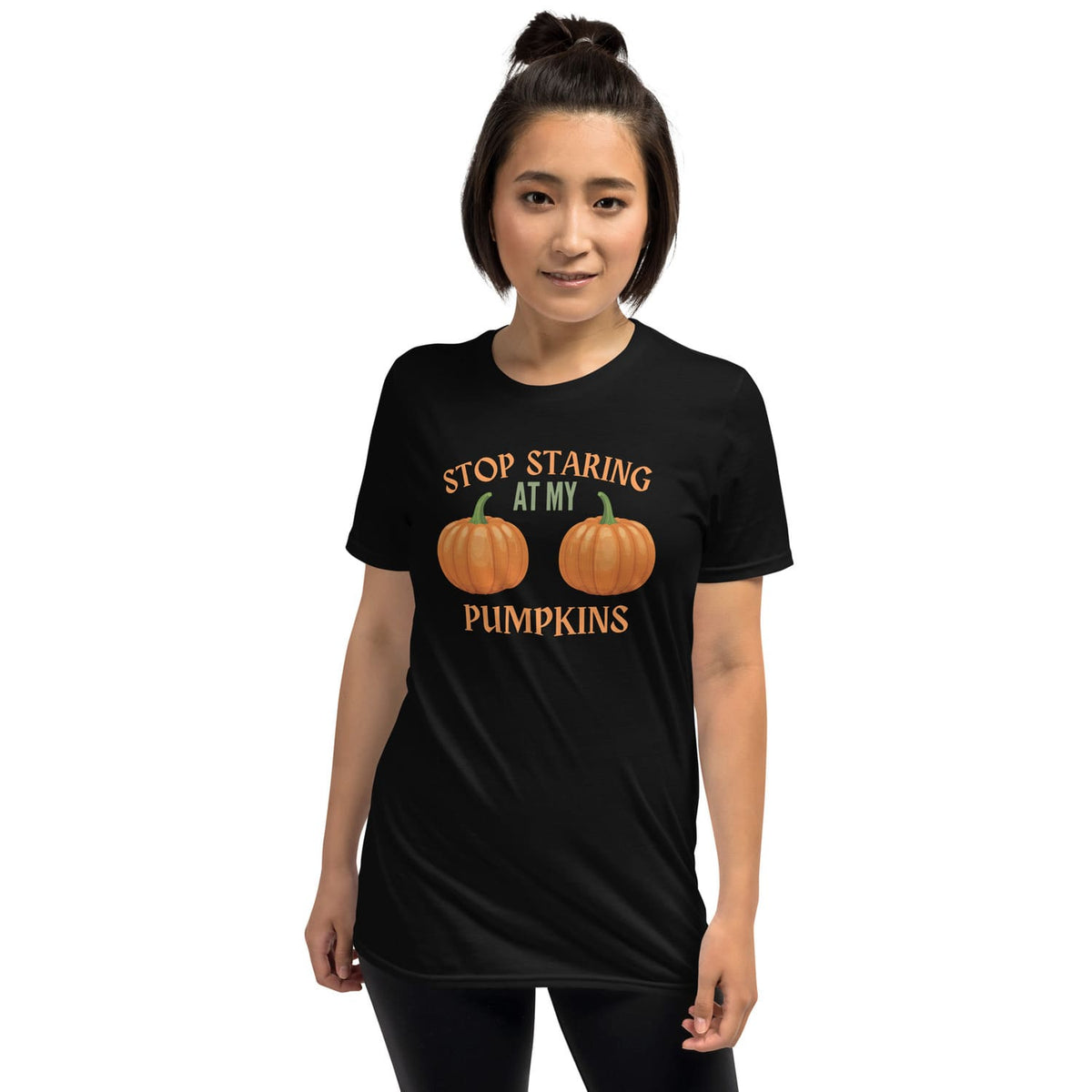 Person wearing a black halloween t-shirt with adult humor pumpkin design and text on a white background