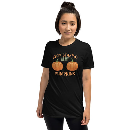 Person wearing a black halloween t-shirt with adult humor pumpkin design and text on a white background
