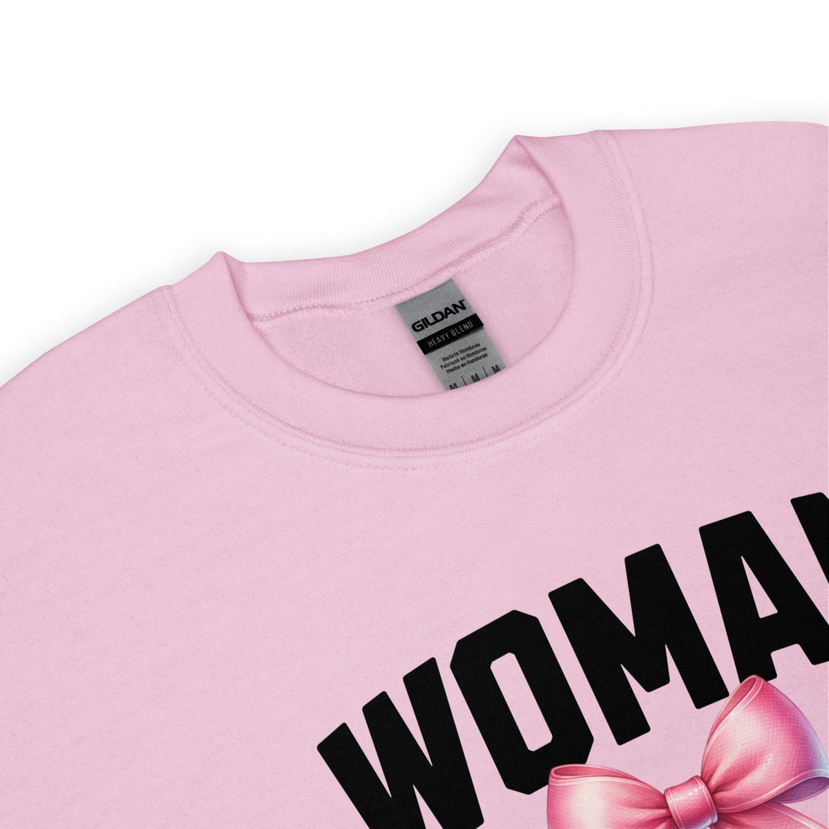 Pink mtf transgender sweatshirt with 'WOMAN' and a pink bow on a white background