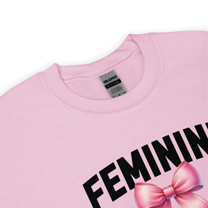 Pink sweatshirt with 'FEMININE' and a pink bow, Gildan label visible.