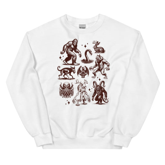 White sweatshirt with cryptids designs on a white background