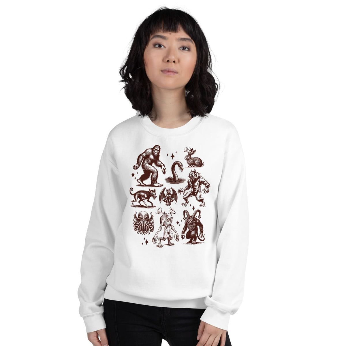 Person wearing a white sweatshirt with cryptids designs on a white background