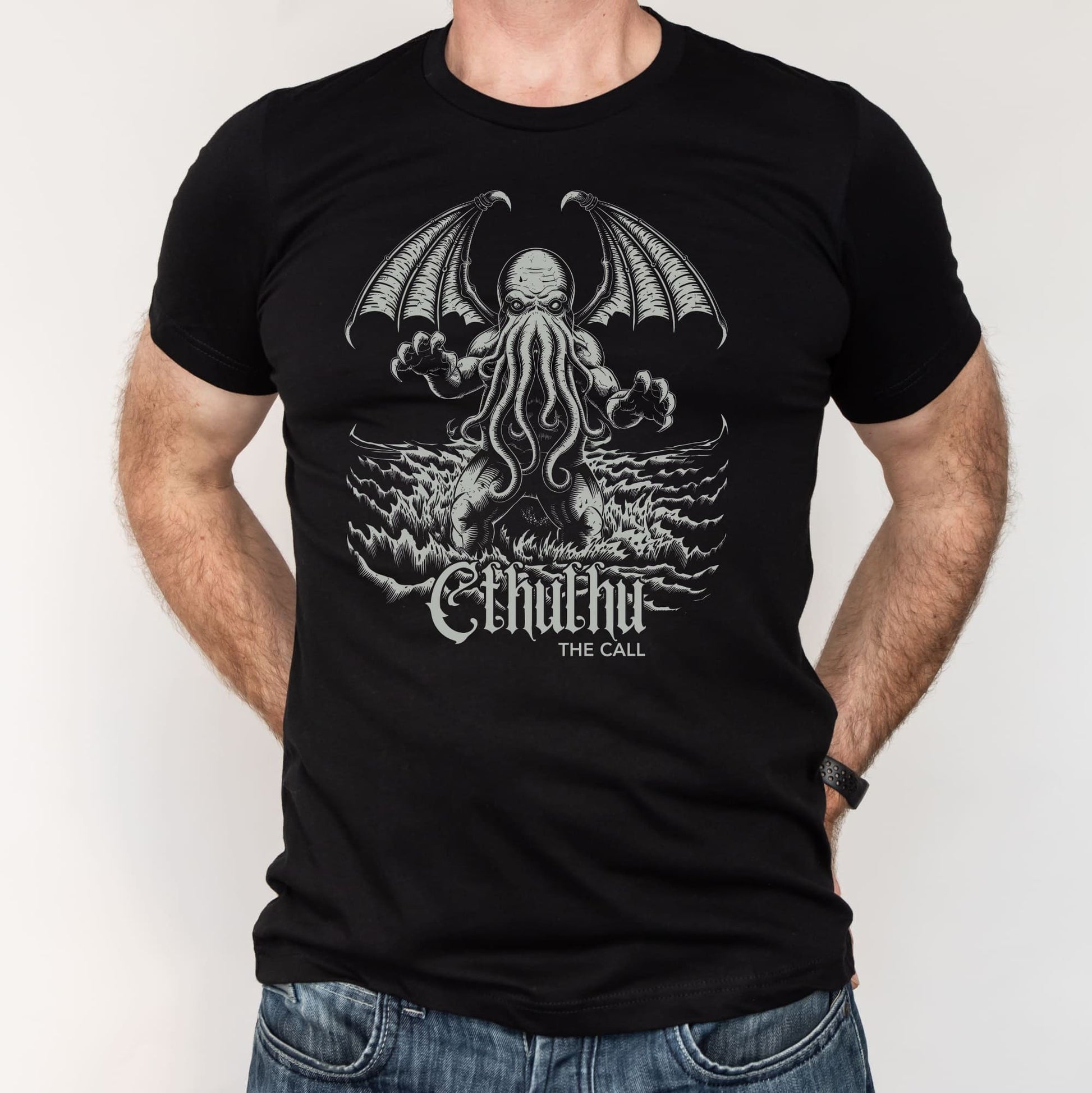 Black t-shirt with a graphic design of cthulhu, worn by a person.