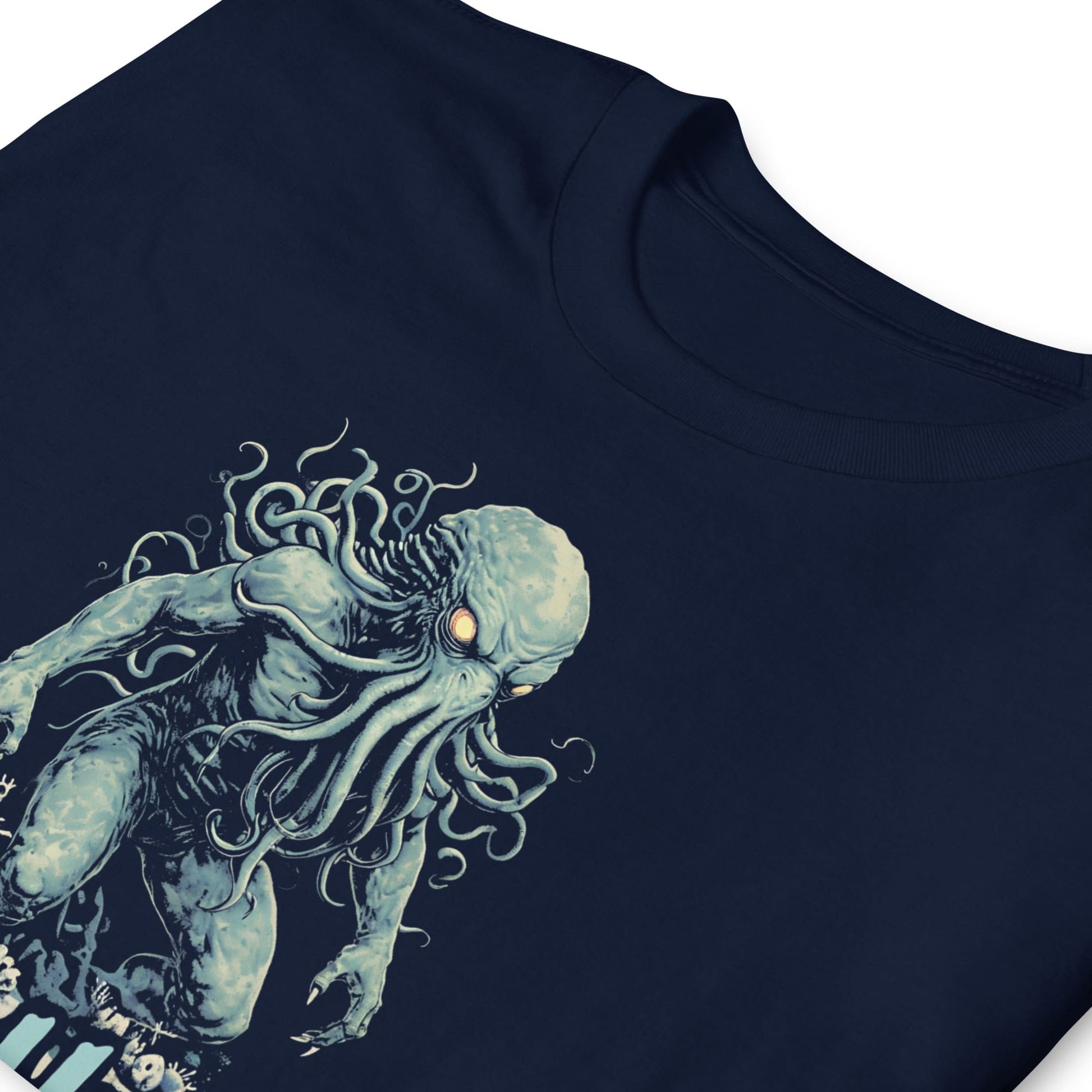 Navy blue t-shirt with a cthulhu creature graphic on a white background