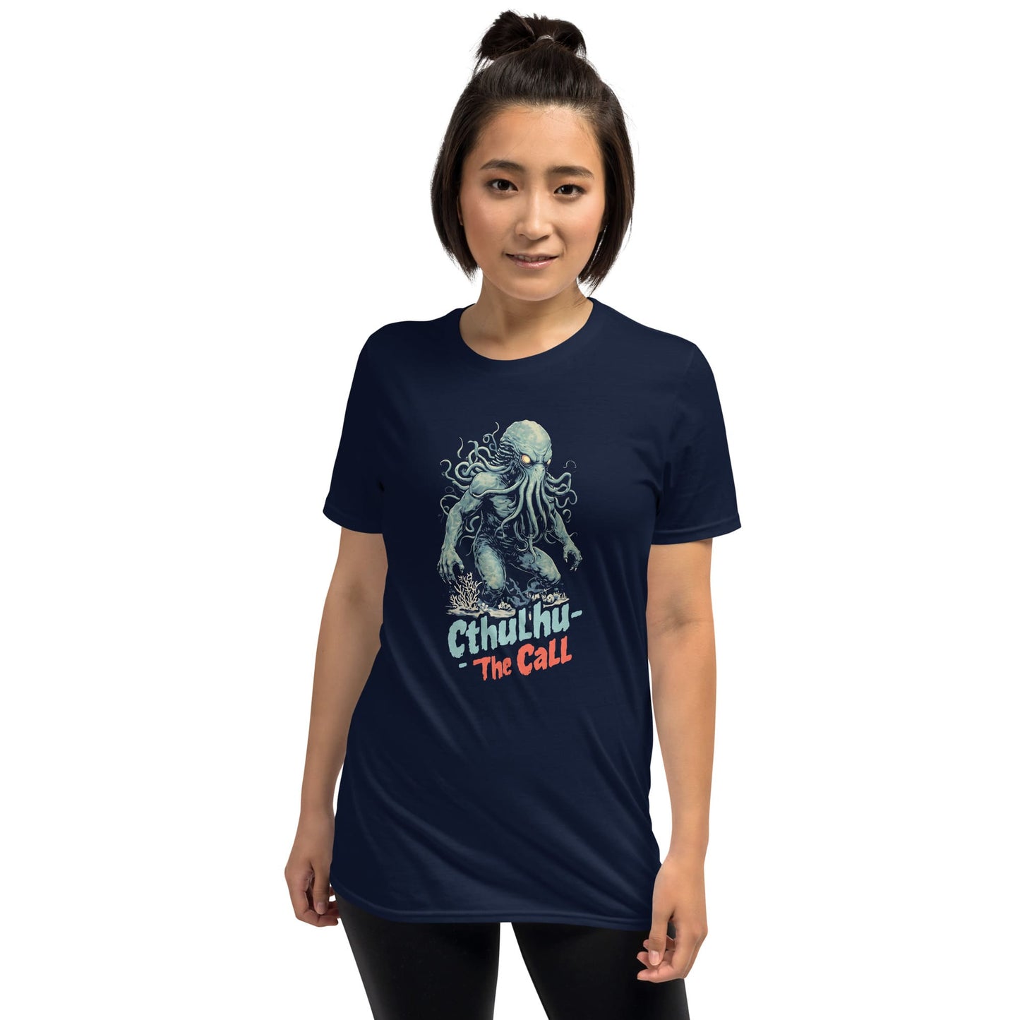 Person wearing a navy blue t-shirt with cthulhu on a white background