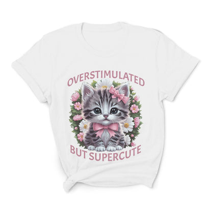 White t-shirt with a kitten graphic and text on a white background: Overstimulated Shirt, Neurodiversity Tee, ADHD Burnout Tshirt, Autism Awareness, Gift For Neurospicy Autistic, Cute Pink Bow Cat T-Shirt