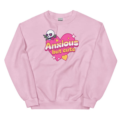 Pink sweatshirt with 'Anxious but cute' design on a white background