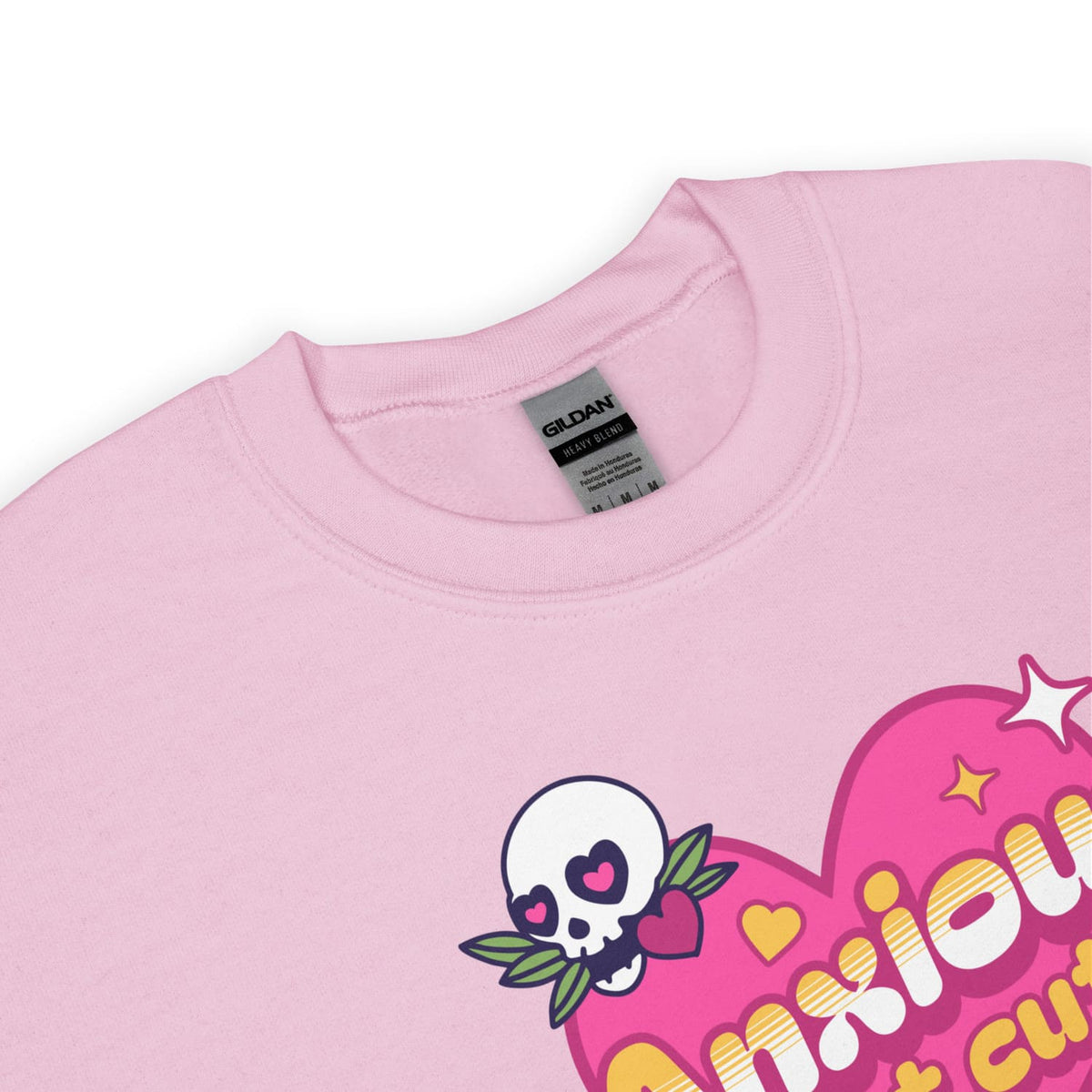 Pink sweatshirt with a skull design and text on a white background