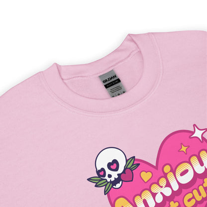 Pink sweatshirt with a skull design and text on a white background