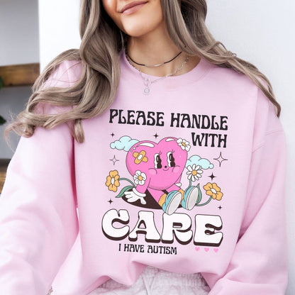 Person wearing a pink autism sweatshirt with a heart and text design, featuring the character Kirby.