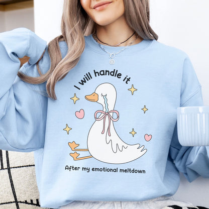 Person wearing a light blue mental health sweatshirt with a cartoon duck design and text.