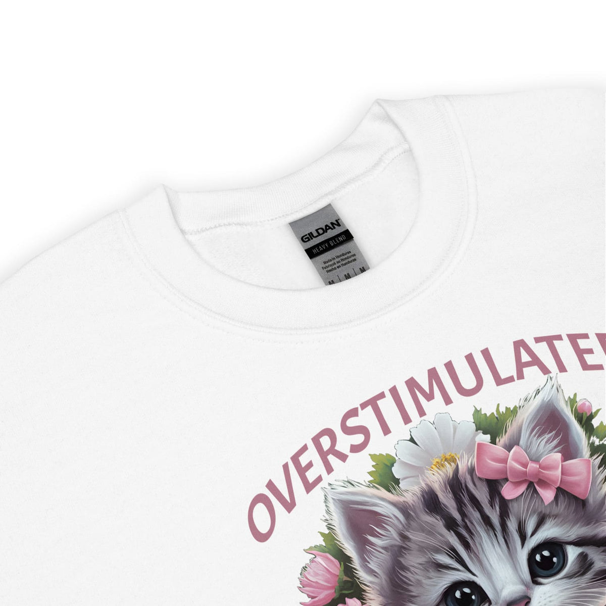 White neurospicy sweatshirt with a kitten graphic and 'OVERSTIMULATED!' text on a white background