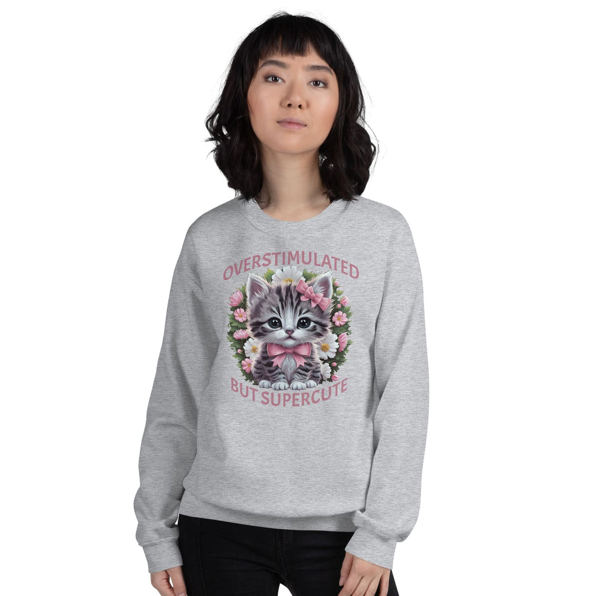 Person wearing a gray neurospicy sweatshirt with a cat graphic and text on a white background