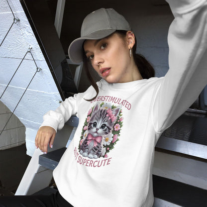 Person wearing a white neurospicy sweatshirt with a cat graphic and text, sitting on stairs.