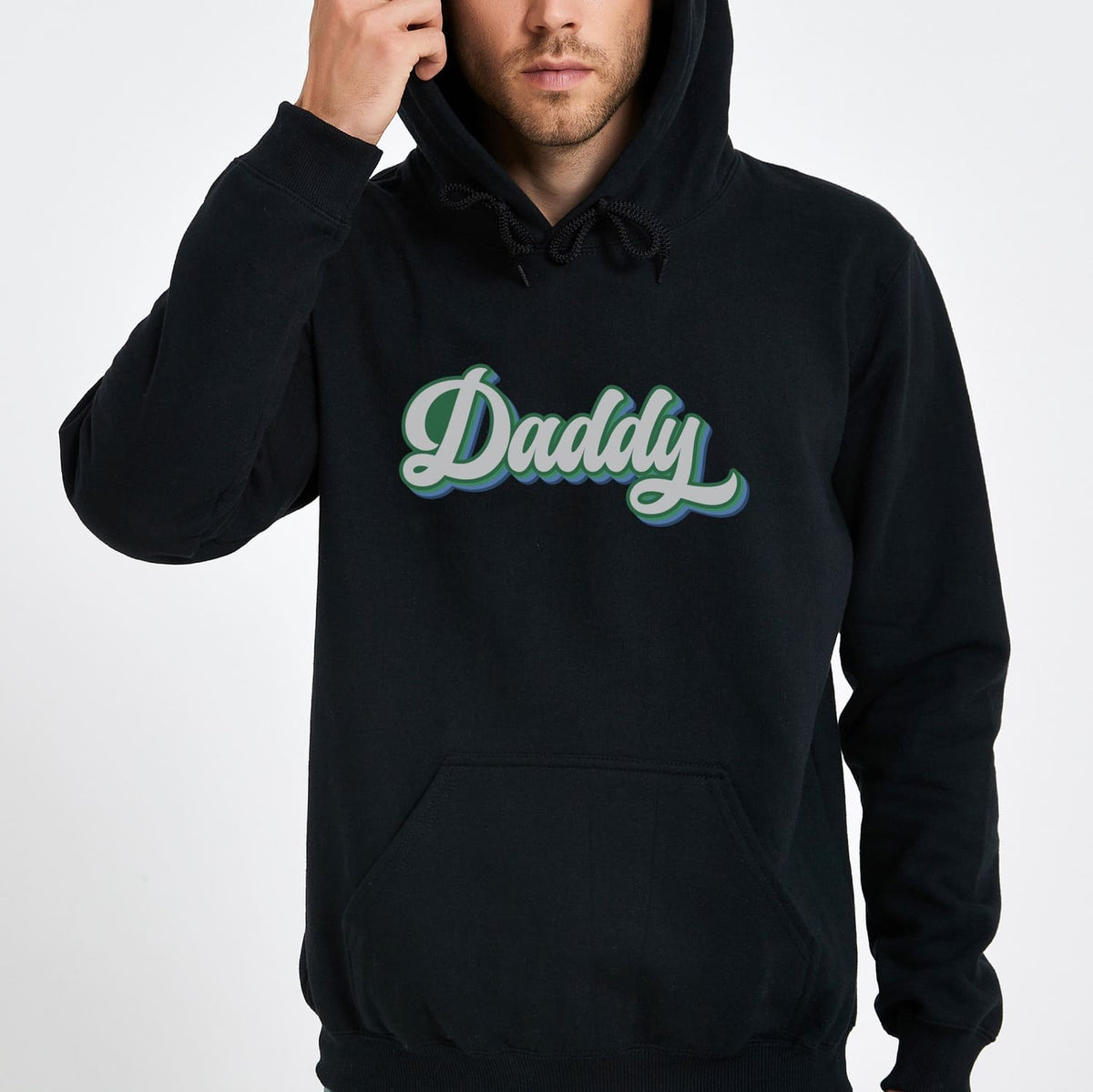 Person wearing a black MLM gay hoodie with 'Daddy' printed on it against a white background