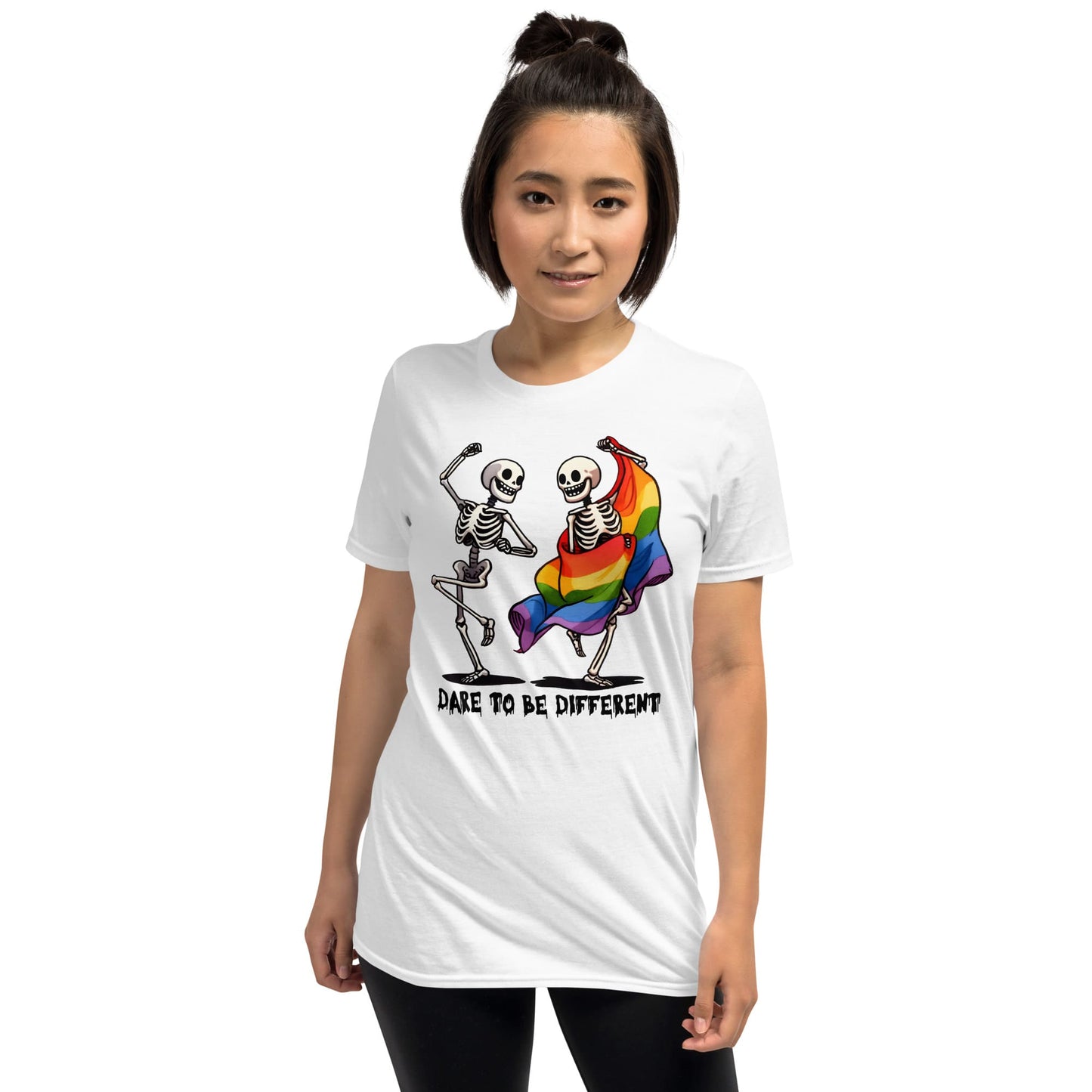 Person wearing a white t-shirt with skeletons holding a rainbow flag and text 'Dare to be different': Dancing Skeletons Pride Shirt, Dare To Be Different LGBTQ Halloween Tee, Rainbow Flag Seasonal T-Shirt, Gay Queer Spooky Gift