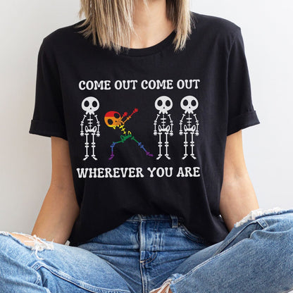 Person wearing a black pride lgbtq t-shirt with skeleton graphics and text.