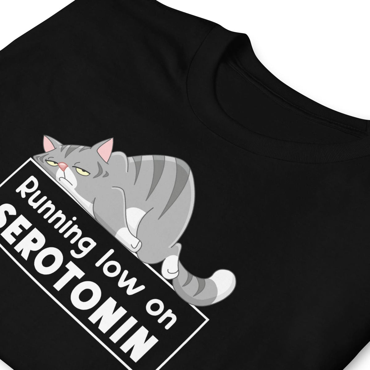Black mental health awareness t-shirt with a cat graphic and text 'Running low on SEROTONIN' on a white background
