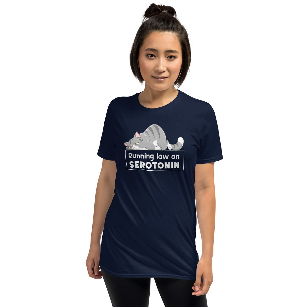 Person wearing a navy blue mental health awareness t-shirt with a graphic and text 'Running low on SEROTONIN' on a white background