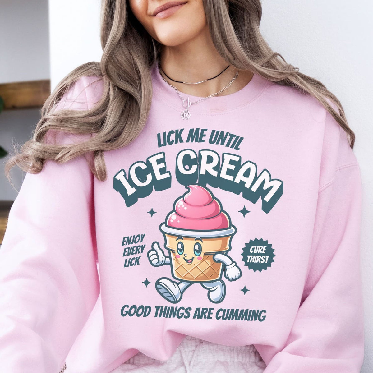 Person wearing a pink adult humor sweatshirt with an ice cream graphic and text.