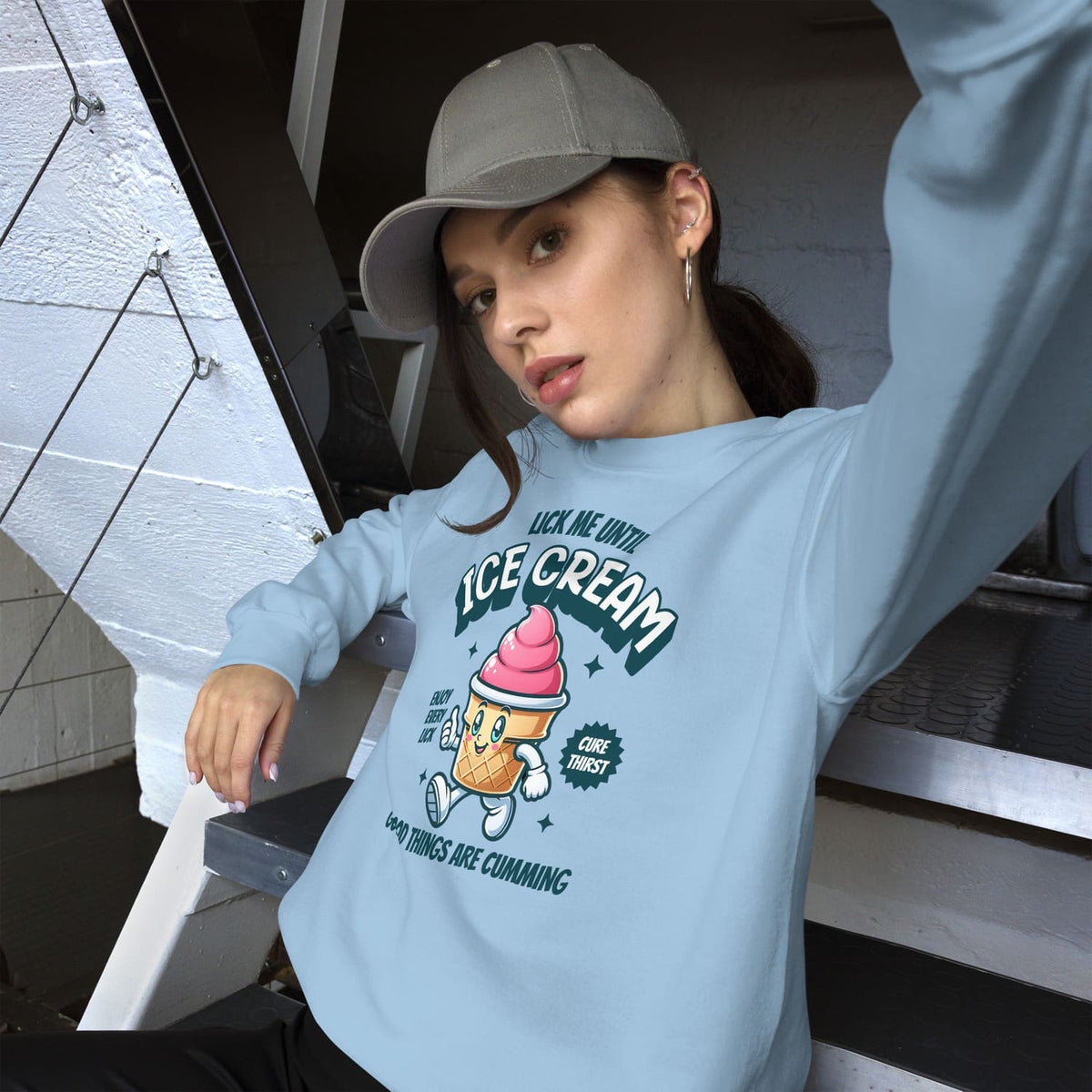 Person wearing a light blue adult humor sweatshirt with an ice cream graphic and text.