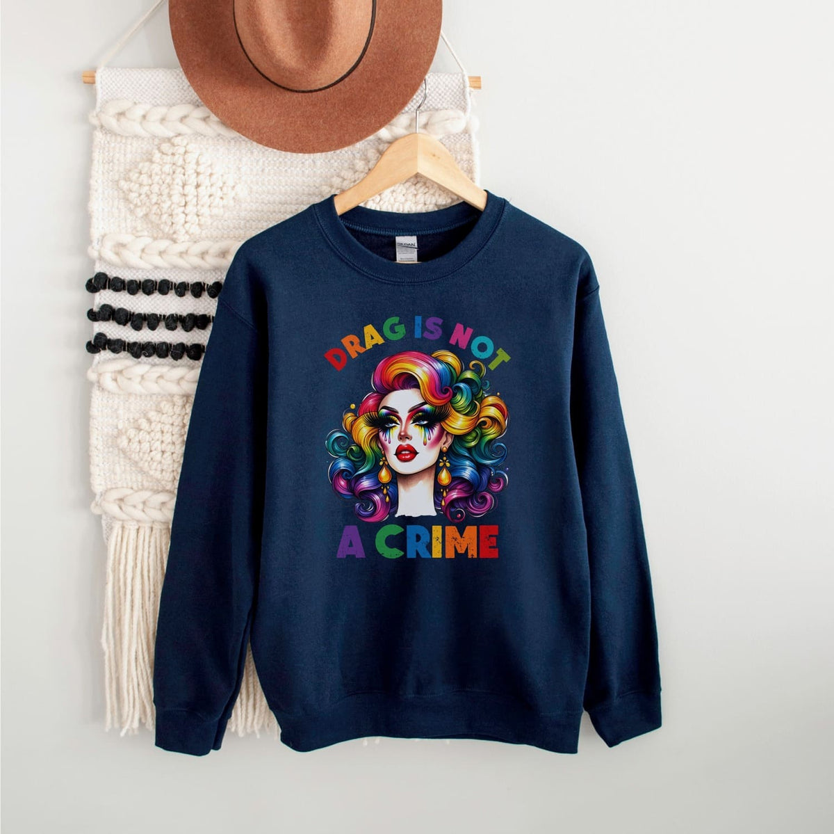 Navy blue sweatshirt with drag queen graphic and text on a white background