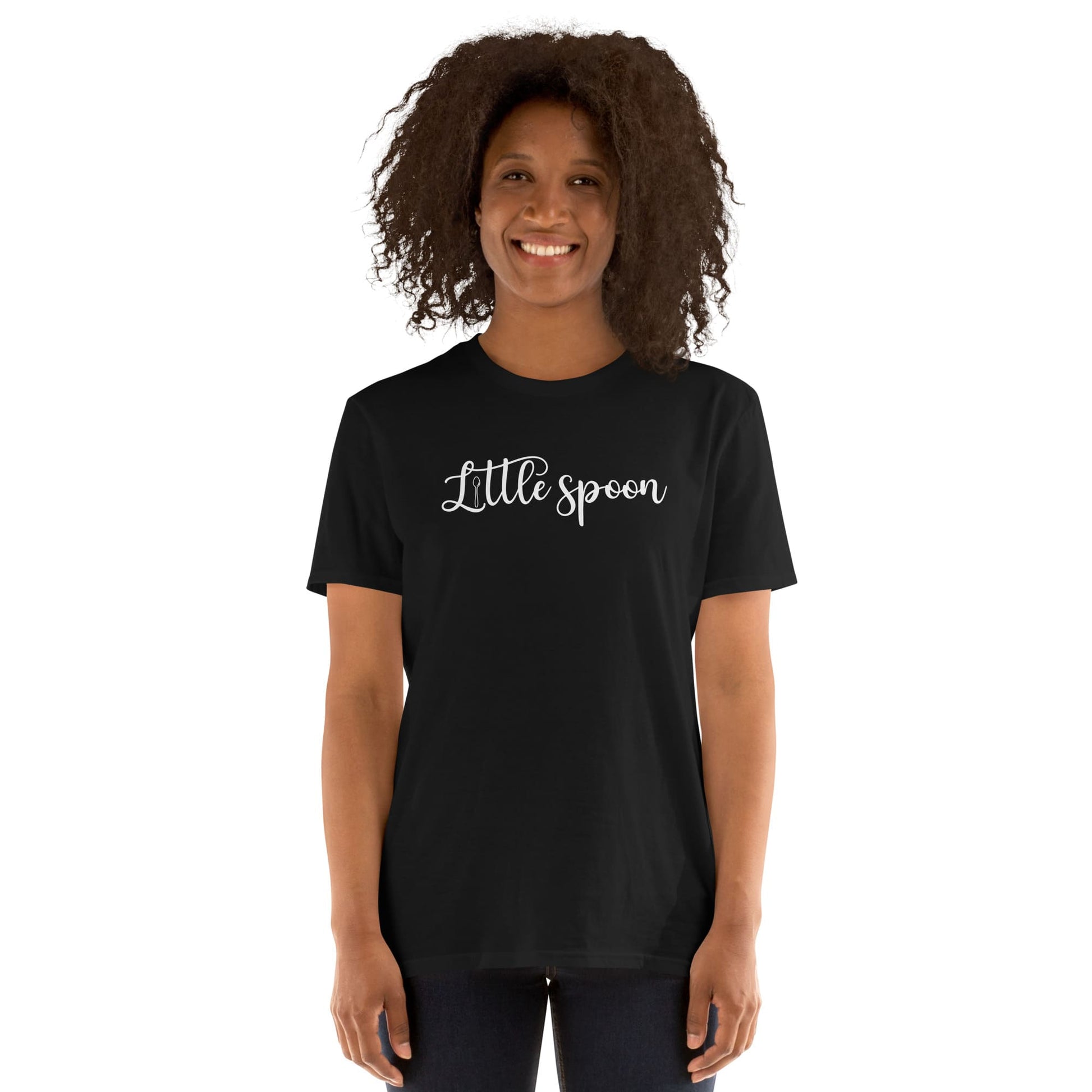 Person wearing a black polyam pride t-shirt with 'Little spoon' ENM text on a white background