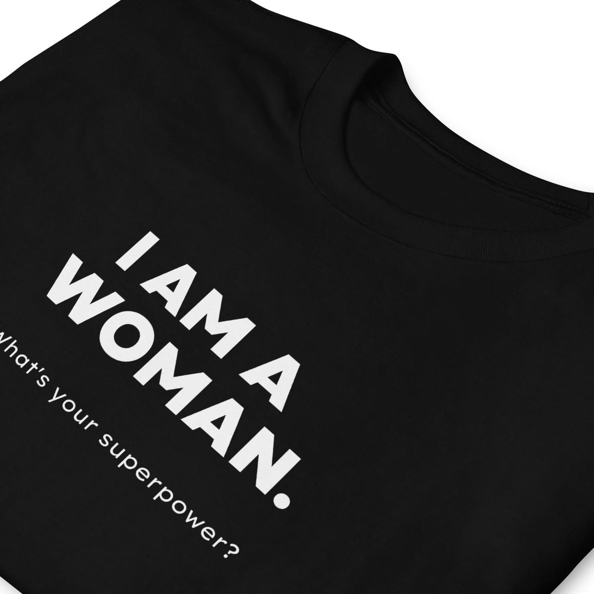 Black feminist t-shirt with white text 'I AM A WOMAN. What's your superpower?'