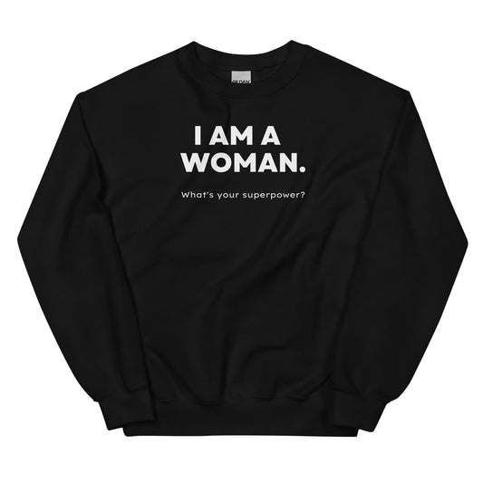 Black feminist sweatshirt with white text 'I AM A WOMAN. What's your superpower?' on a white background