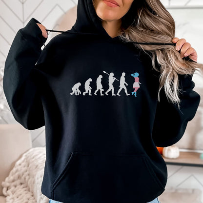 Person wearing a black transgender mtf hoodie with a unique design, standing indoors.