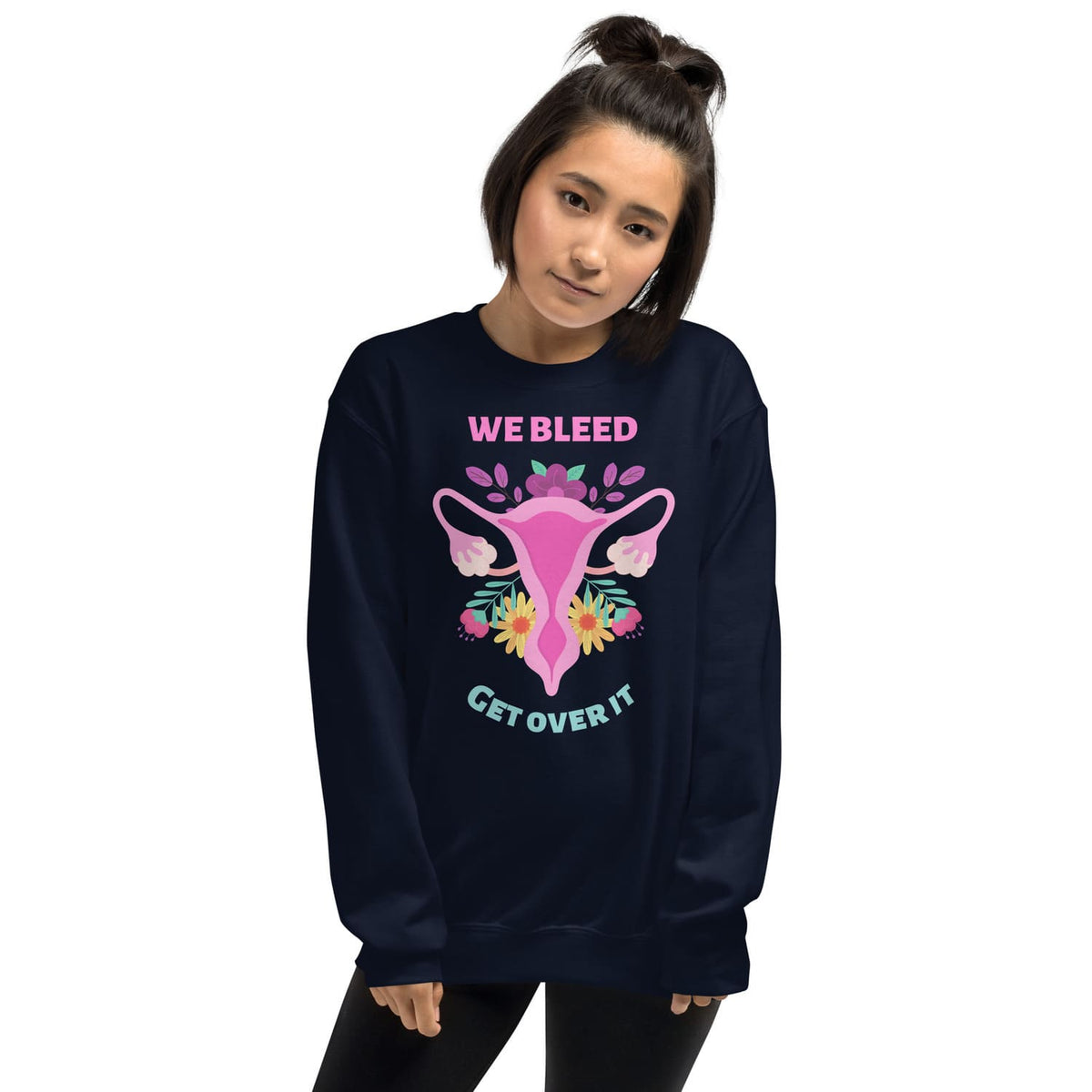 Person wearing a navy blue feminist sweatshirt with a graphic design and text on a white background