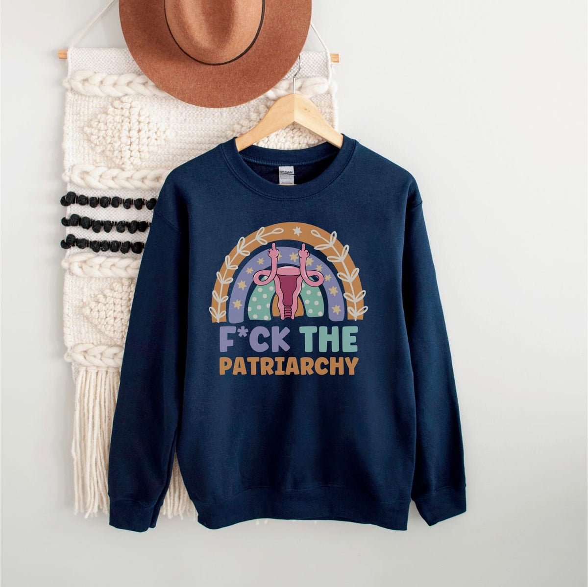 Navy blue sweatshirt with feminist design and text on a white background