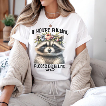 Person wearing a white t-shirt with a raccoon graphic and text, sitting on a couch: Subtle Neurodivergent Shirt, Autism Awareness Tee, ADHD AuDHD Warrior T-Shirt, Cute Raccoon Shirt For Neurospicy, Neurodivergent Gift