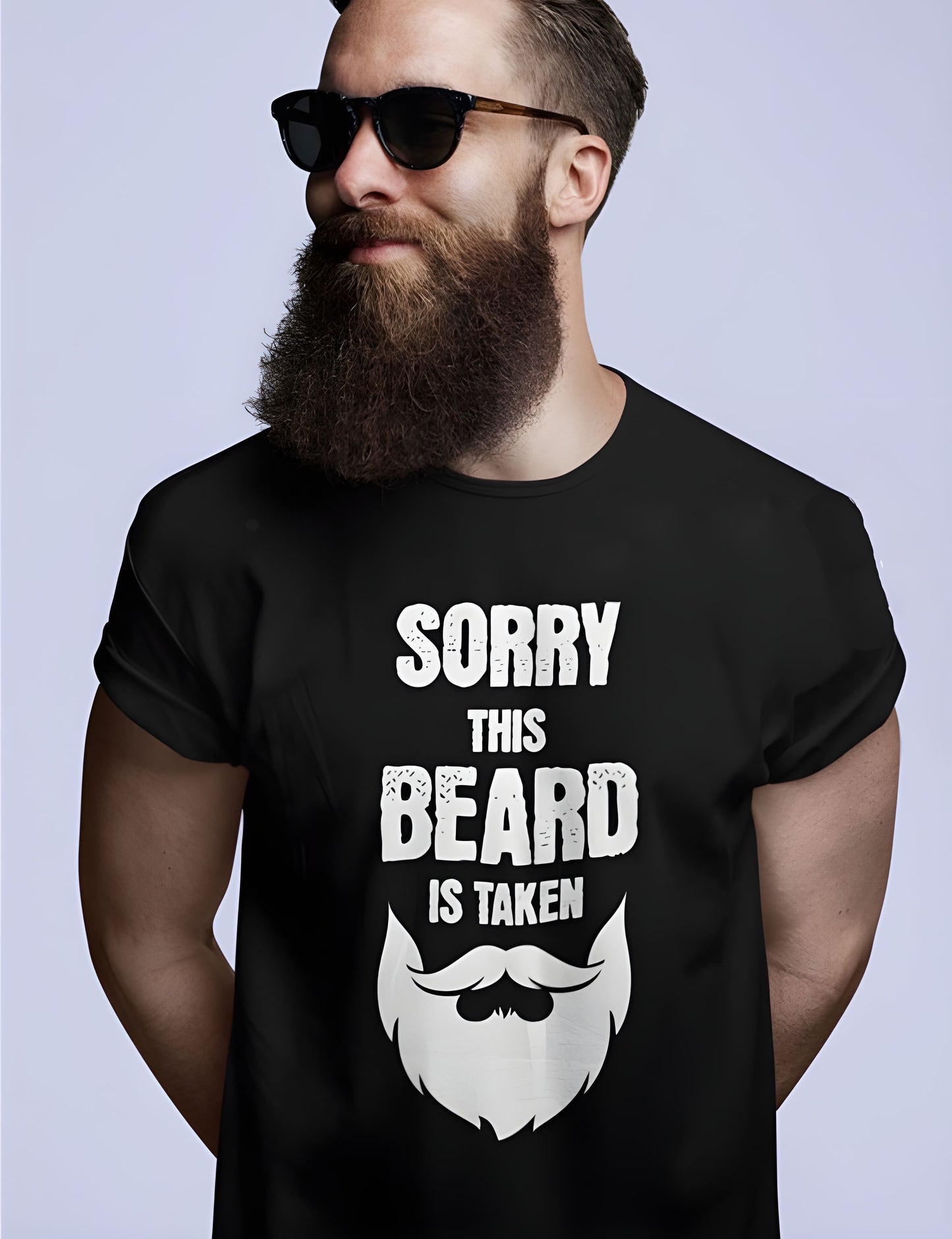 Man wearing a black t-shirt with a beard graphic and text on a plain background