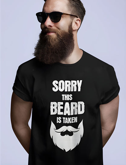 Man wearing a black t-shirt with a beard graphic and text on a plain background