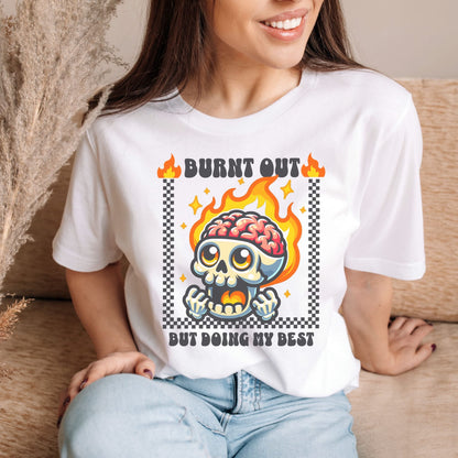 Person wearing a white t-shirt with a graphic design featuring a skull and flames: Funny Mental Health Shirt, Burnout Tee, Retro Neurodivergent T-Shirt, Cute Skull Gift For Autism Warrior, Overstimulated Shirt For Depressed