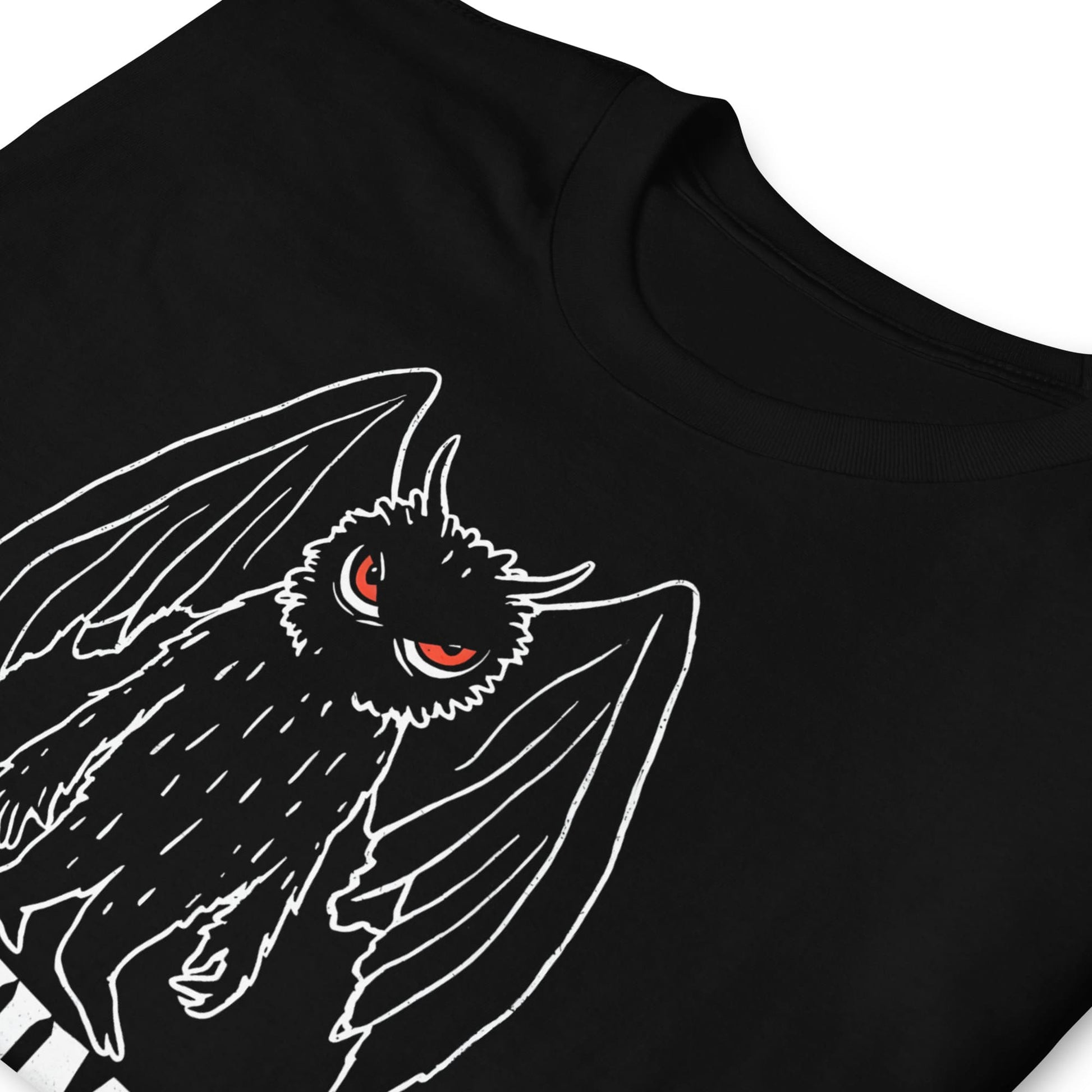 Black t-shirt with a white line drawing of mothman on a white background