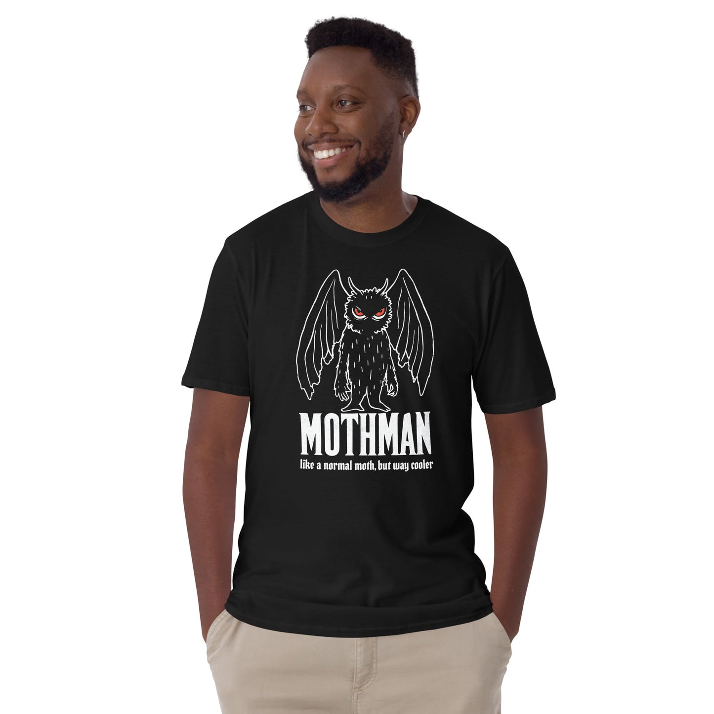 Man wearing a black t-shirt with Mothman graphic and text on a white background