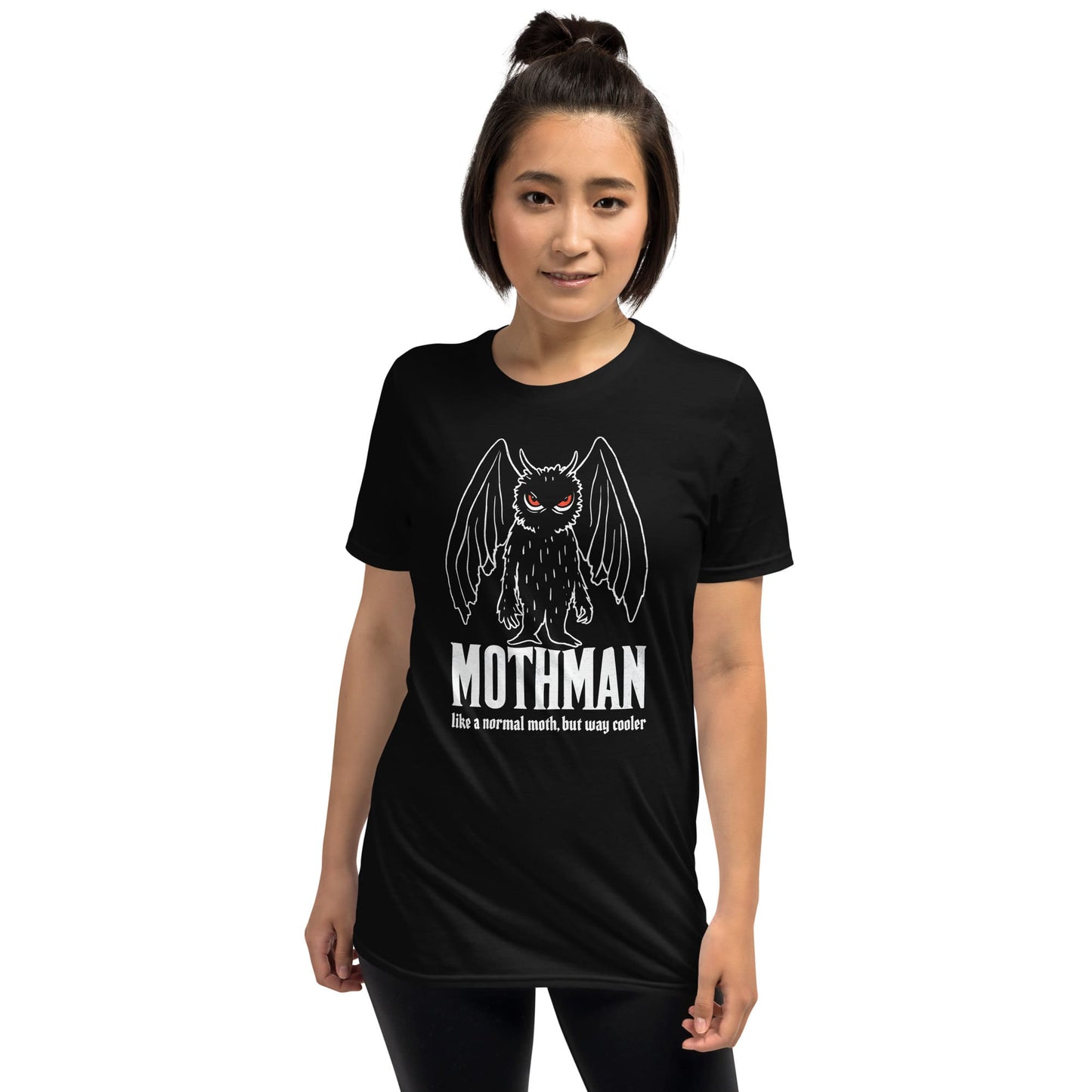 Person wearing a black t-shirt with Mothman graphic and text on a white background