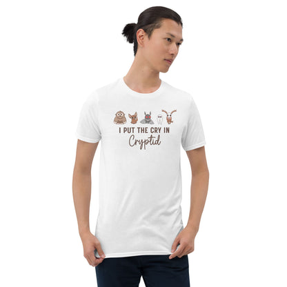 Person wearing a white t-shirt with cartoon characters and text on a white background: Funny Cryptid Mental Health Awareness Comfort Colors Shirt, Cute Cryptidcore Neurodivergent Tee, Kawaii Cryptozoology Neurospicy T-Shirt
