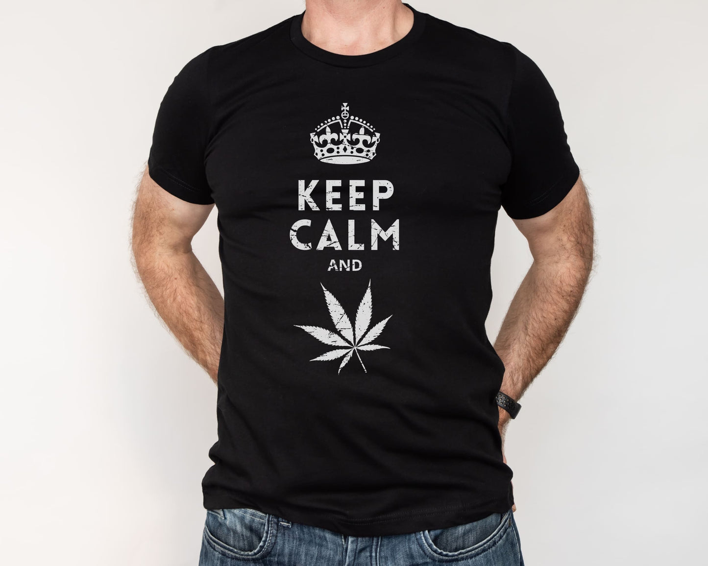 Black t-shirt with 'Keep Calm and' and a cannabis leaf design on a plain background