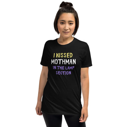 Person wearing a black t-shirt with humorous text design on a white background: Nonbinary Humor Shirt, Funny Mothman Cryptid Tee, Spooky Queer Pride Gift, LGBTQ Meme T-Shirt ,Enby Weirdcore Top, Cryptidcore Mythology