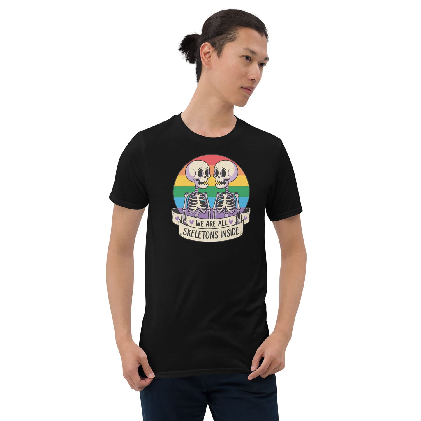 Person wearing a black t-shirt with a colorful graphic and text on a white background: Pride Halloween Shirt, Funny Gay Skeletons On Rainbow Flag, LGBTQ Equality Diversity Human Rights Social Justice Tee, LGBT Gift For Queer