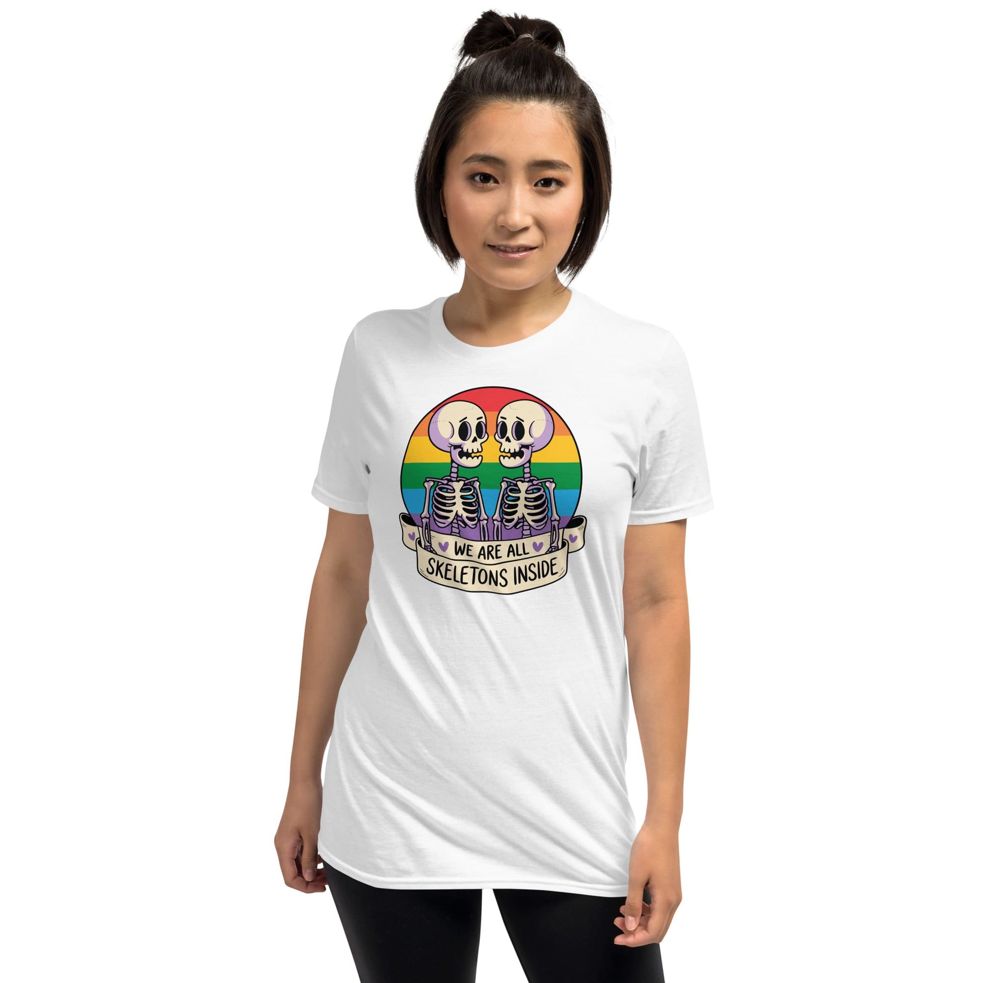 Person wearing a white t-shirt with a colorful skeleton design and text on a white background: Pride Halloween Shirt, Funny Gay Skeletons On Rainbow Flag, LGBTQ Equality Diversity Human Rights Social Justice Tee, LGBT Gift For Queer