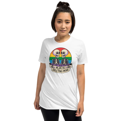 Person wearing a white t-shirt with a colorful skeleton design and text on a white background: Pride Halloween Shirt, Funny Gay Skeletons On Rainbow Flag, LGBTQ Equality Diversity Human Rights Social Justice Tee, LGBT Gift For Queer
