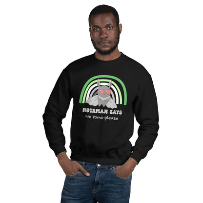 Man wearing a black aromantic sweatshirt with mothman and text on a white background