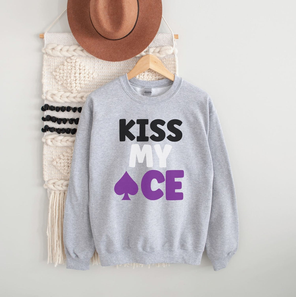 Gray asexual sweatshirt with 'KISS MY ACE' text on a white background