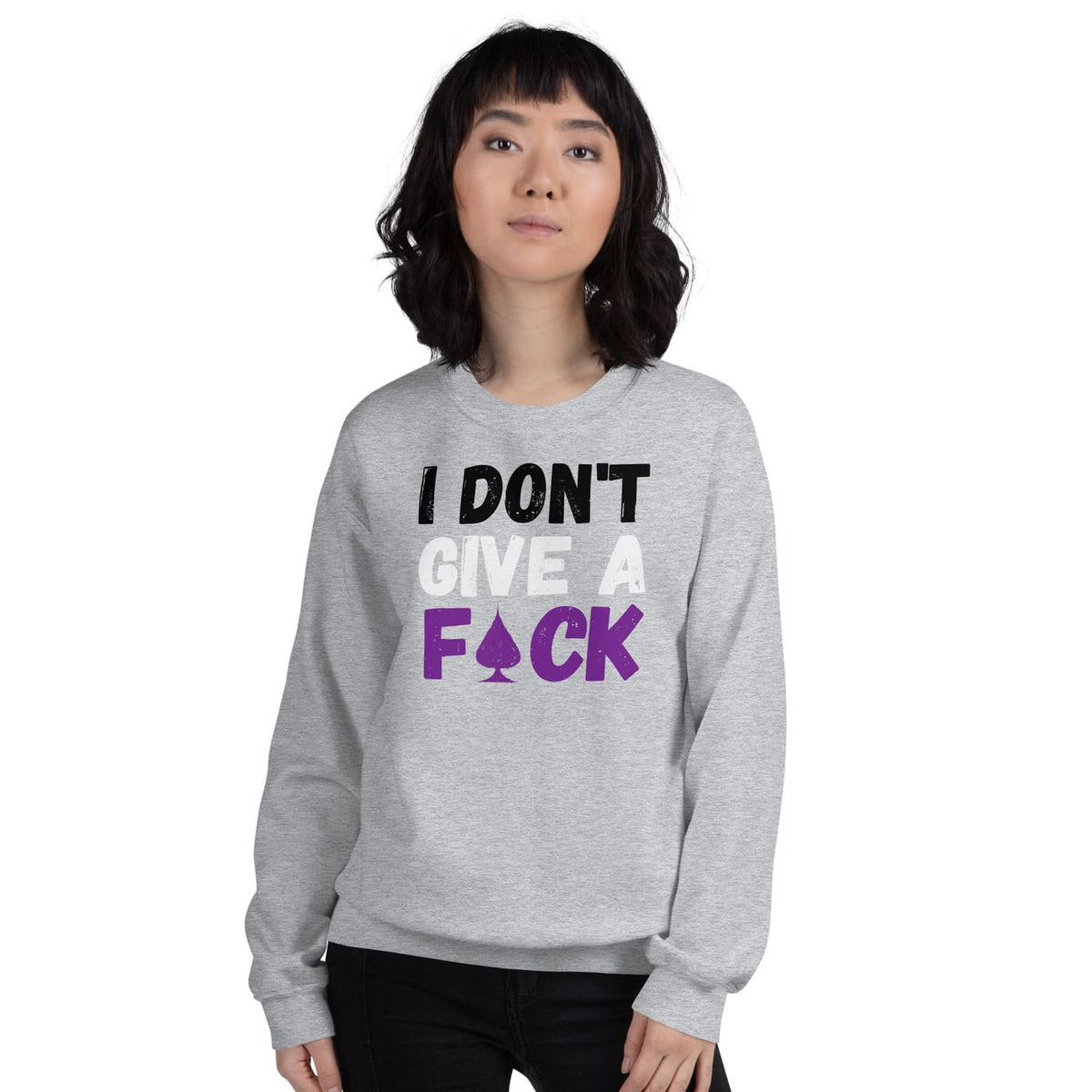 Person wearing a gray asexual sweatshirt with text 'I DON'T GIVE A F*CK' on a white background
