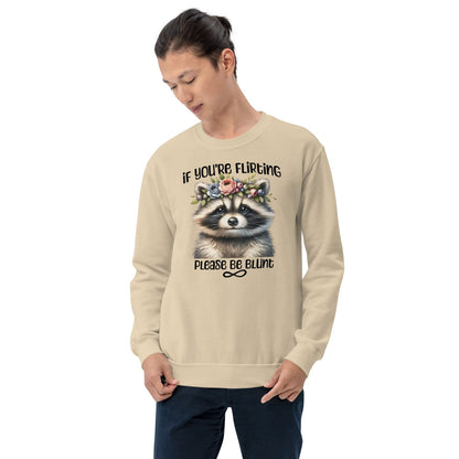 Person wearing a beige funny autistic sweatshirt with a raccoon graphic and text on a white background